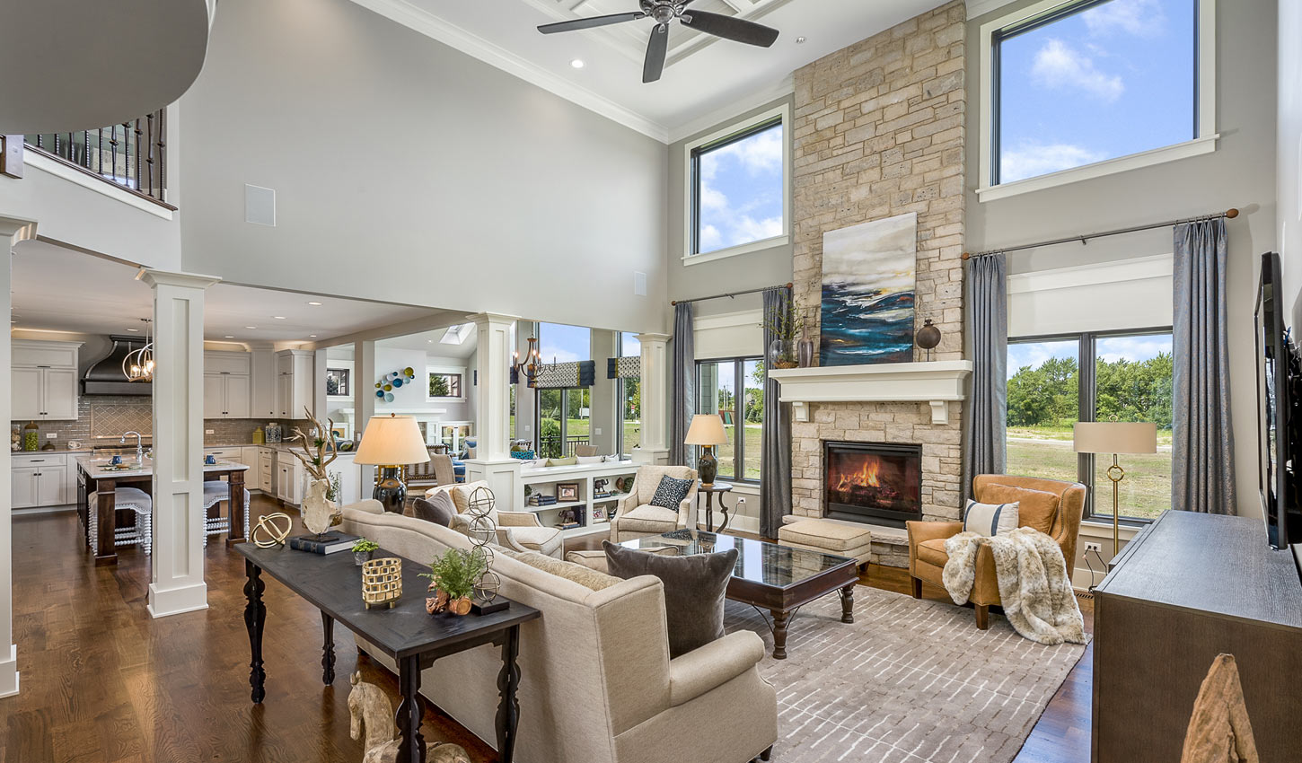 Open floor plan model home with fireplace