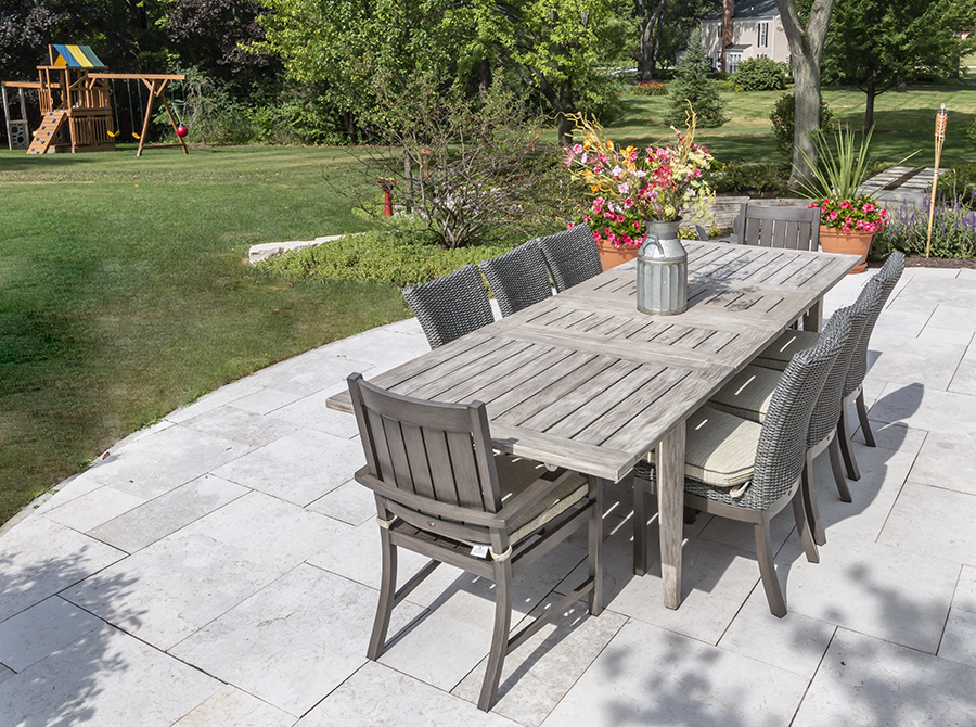 Outdoor dining table on slate patio