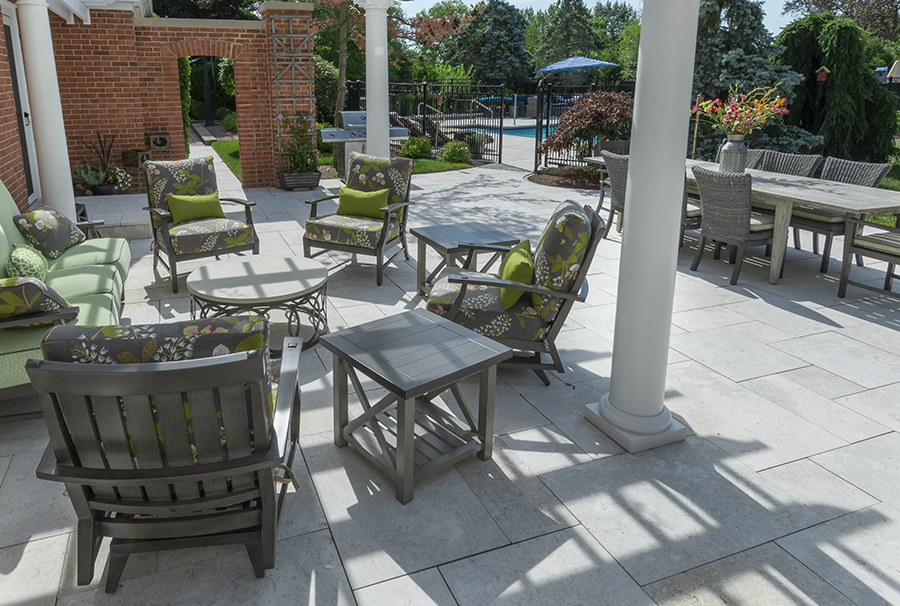 Patio with upholstered furniture, dining space and view to a pool