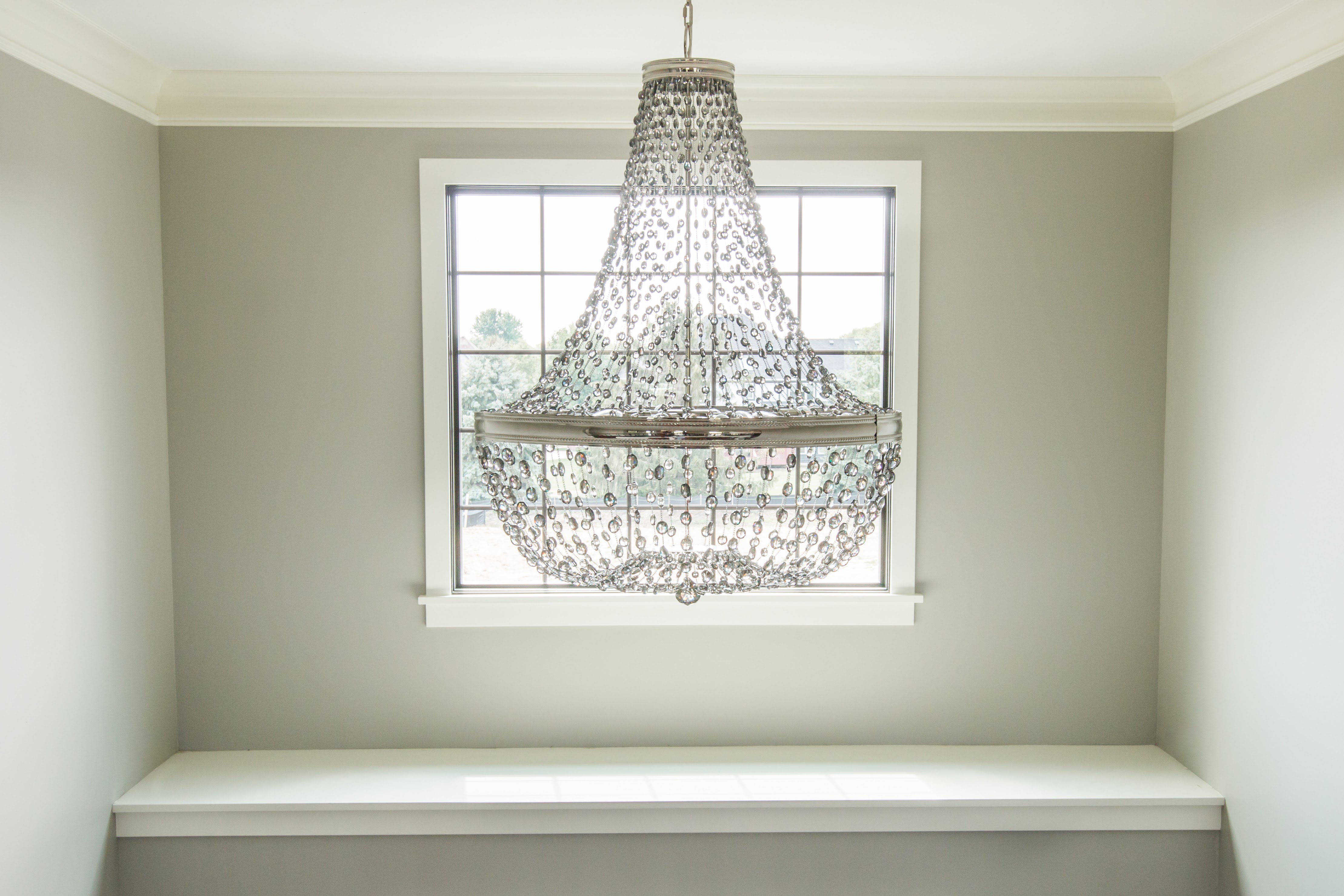 Silver and crystal chandelier in two story foyer