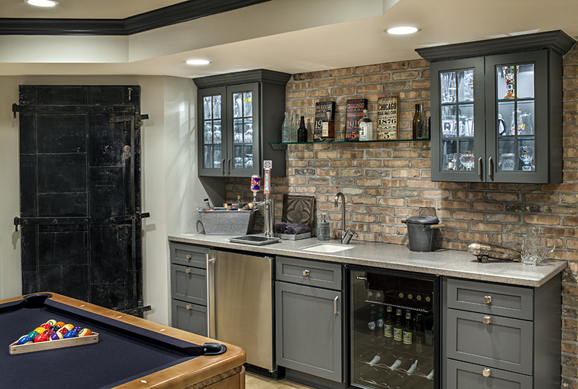 Vintage style bar area with kegerator and wine fridge and glass door cabinets