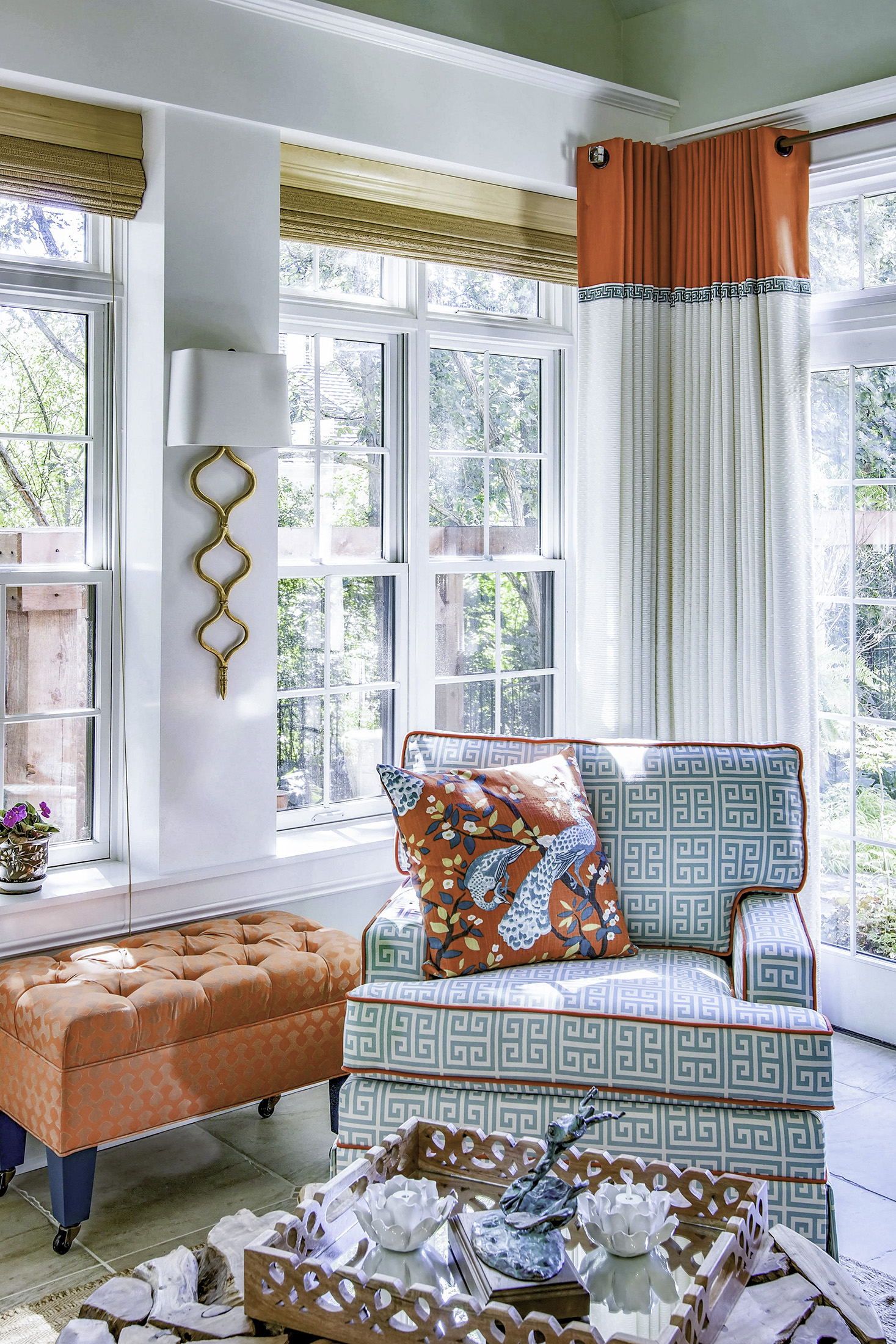 Aqua and coral chair and drapery in sunroom