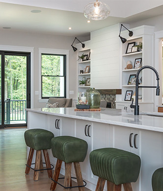 Modern farmhouse kitchen with white island and wood cabinets