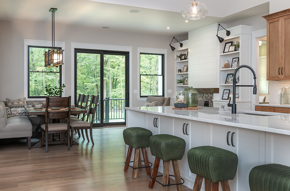 Modern farmhouse kitchen island and eating area with settee
