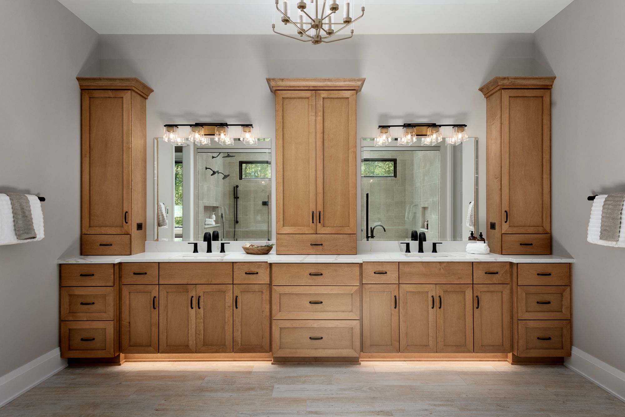 Master bathroom with large double vanity in wood and black hardware